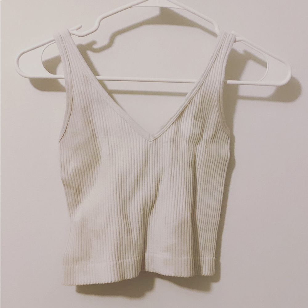 This white tank is a staple and is supper cut with baggy jeans and air forces